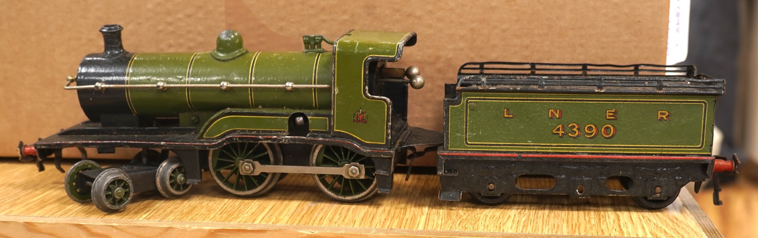 A Bing for Bassett Lowke 0 gauge tinplate clockwork LNER Ivatt 4-4-0 tender locomotive, 4390, together with an early Hornby clockwork 0-4-0, 2710, in GNR green livery with Meccano Ltd roundels to locomotive splasher and